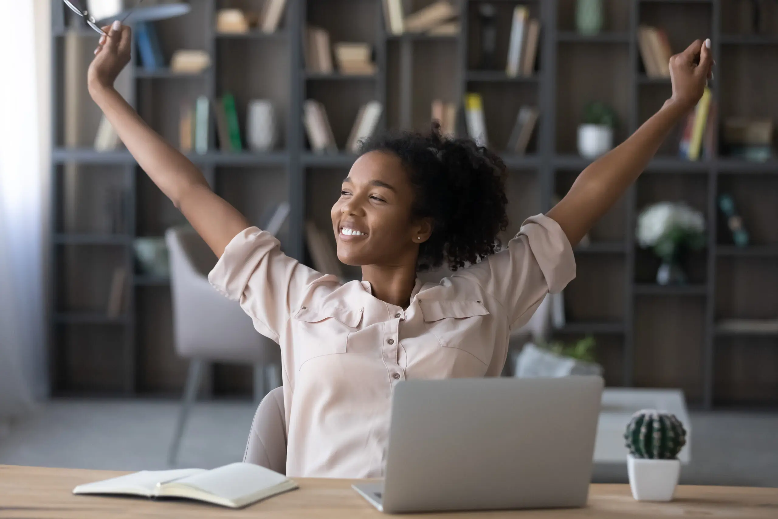 Smiling african american woman relaxing finishing job.